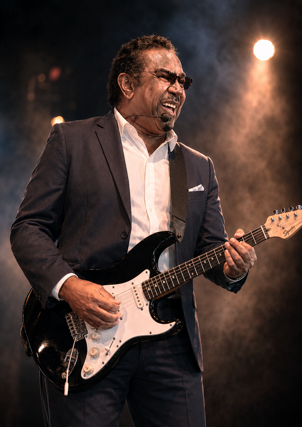 Eugene Genay Williams performing with guitar