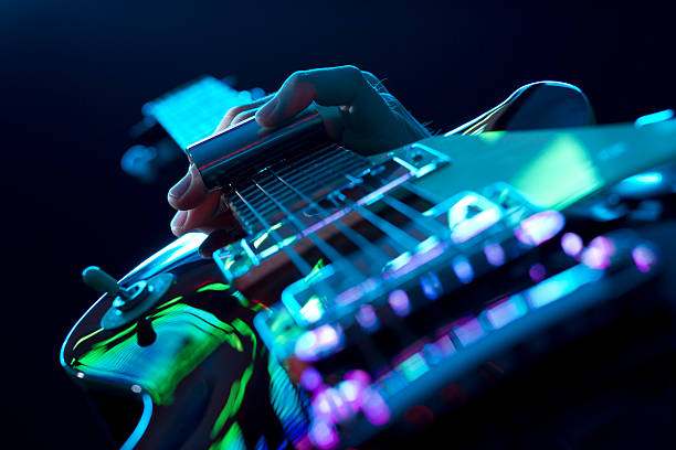 rock/blues guitar player on stage, slide guitar